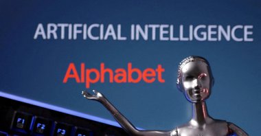 Alphabet logo and AI Artificial Intelligence words are seen in this illustration taken, May 4, 2023. (Reuters Photo)