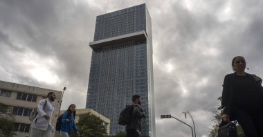 People walk past the Selection La Habana new hotel, managed by Spanish chain Iberostar, in Havana, Cuba, Jan. 24, 2025. (AP Photo)