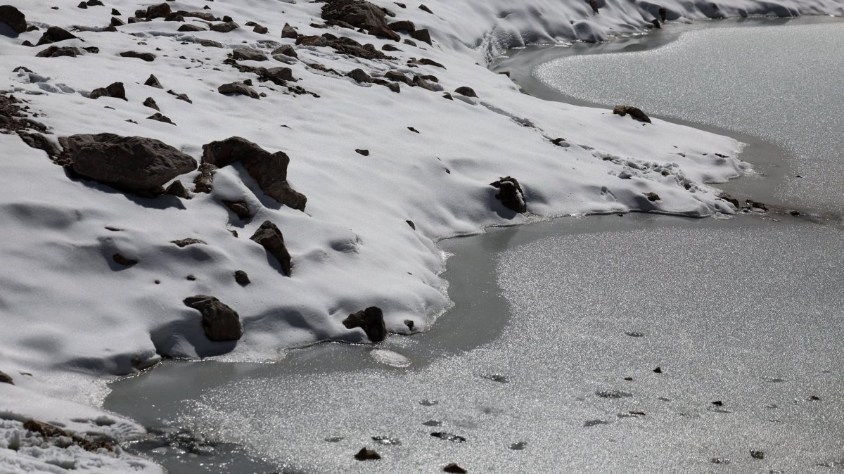 Melting ice of a small pool of the Schneeferner Glacier below Germany&#039;s highest mountain Zugspitze, near Garmisch-Partenkirchen, Germany, Sept. 26, 2023. (EPA Photo)