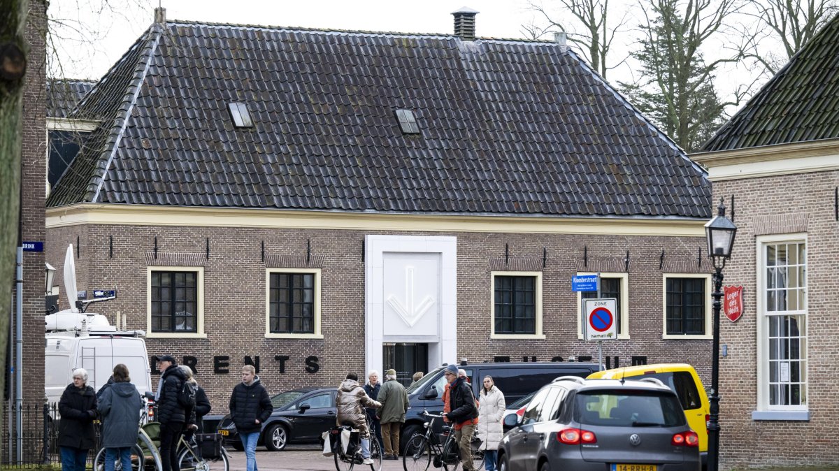 People stand outside the Drents Museum, which was announced to be closed over the weekend following an explosion and theft, Assen, Netherlands, Jan. 25, 2025. (EPA Photo)