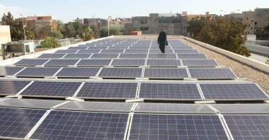 A man stands among solar panels installed by the United Nations Development Programme (UNDP) at Abu Salem hospital in Tripoli, Libya, Jan. 29, 2017. (Reuters Photo)