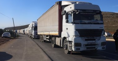 Trucks are seen near the Cilvegözü border crossing with Syria in the Reyhanlı district of the southern province of Hatay, Türkiye, Jan. 20, 2025. (IHA Photo)