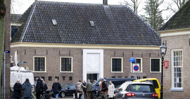 People stand outside the Drents Museum, which was announced to be closed over the weekend following an explosion and theft, Assen, Netherlands, Jan. 25, 2025. (EPA Photo)