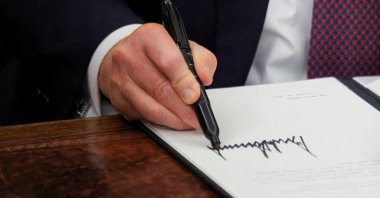 U.S. President Donald Trump signs documents as he issues executive orders in the Oval Office at the White House on Inauguration Day, Washington, U.S., Jan. 20, 2025. (Reuters Photo)