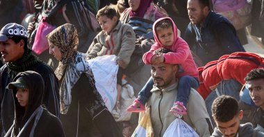 People walk along Gaza's coastal al-Rashid Street to cross the Netzarim corridor from the southern Gaza Strip, Palestine, Jan. 27, 2025. (AFP Photo)