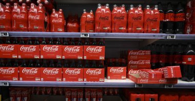 This photograph shows packs of Coca-Cola bottles on a supermarket shelf in Septemes-les-Vallons near Marseille, France, Nov. 3, 2022. (AFP Photo)