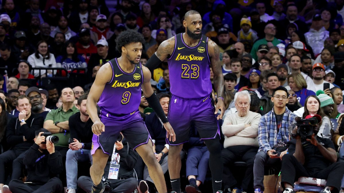 Bronny James (R) stands by LeBron James of the Los Angeles Lakers during the second half against the Philadelphia 76ers at the Wells Fargo Center, Philadelphia, Pennsylvania, U.S., Jan. 28, 2025. (AFP Photo)
