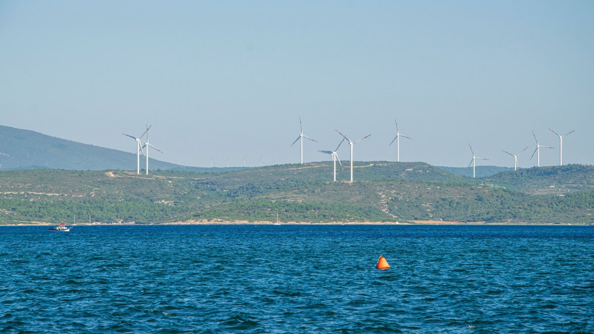 Wind turbines are seen in Sığacık, a seaside neighborhood of Seferihisar district in the western province of Izmir, Türkiye, Dec. 14, 2020. (Shutterstock Photo)