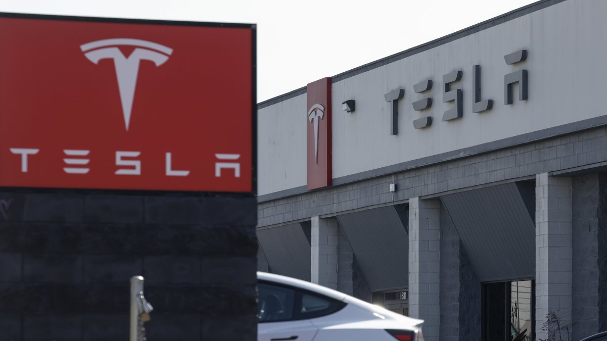 Telsa signage is displayed outside of a Tesla showroom, Burbank, California, U.S., Jan. 29, 2025. (EPA Photo)