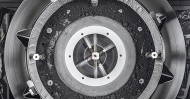 This image provided by NASA shows a top-down view of the OSIRIS-REx Touch-and-Go-Sample-Acquisition-Mechanism (TAGSAM) head with the lid removed, revealing the remainder of the asteroid sample inside. (AP Photo)