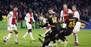 Galatasaray's Nigerian forward Victor Osimhen (R) shoots and scores his team's first goal during the UEFA Europa League match against Ajax, in Amsterdam, the Netherlands, Jan. 30, 2025. (AFP Photo)