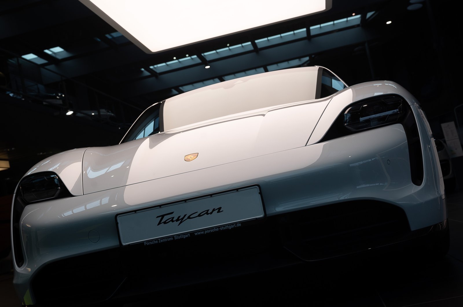 An electric Porsche Taycan Turbo S stands in the Porsche Center, Stuttgart, Germany, March 16, 2021. (Getty Images Photo)