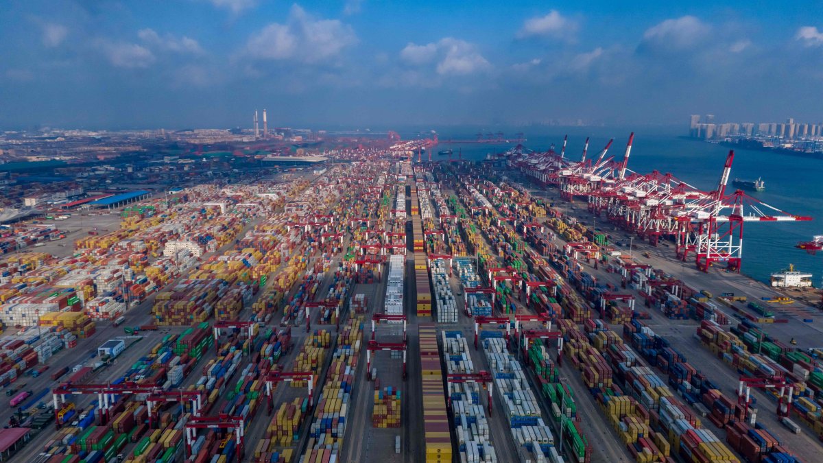 Ships are loaded at the container terminal of the port in Qingdao, eastern Shandong province, China, Jan. 25, 2025. (AFP Photo)