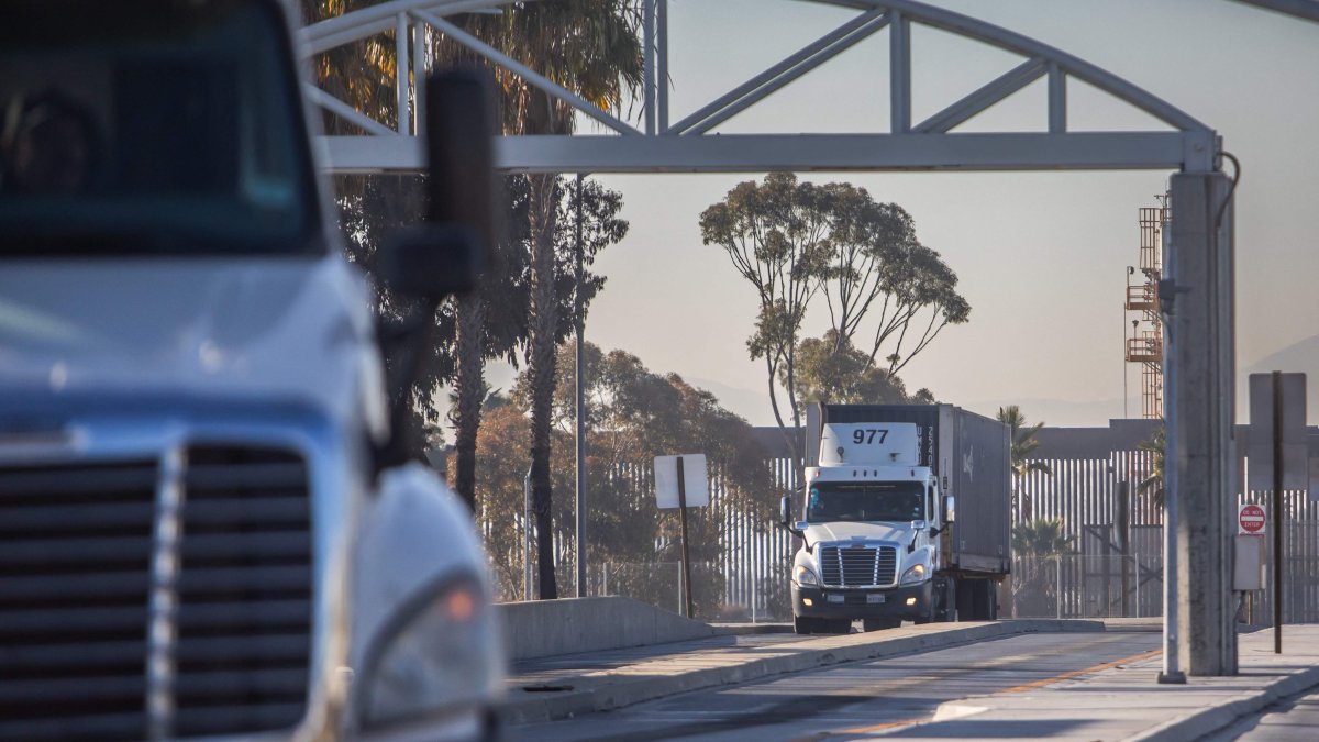 Trucks drive into United States at the Otay Mesa Port of Entry, on the U.S.-Mexico border in San Diego, California, U.S., Feb. 1, 2025. (AFP Photo)