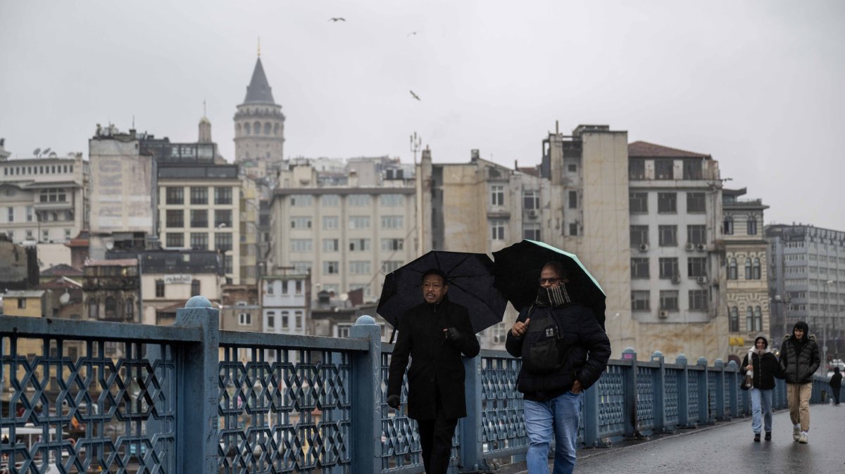 People walk over Galata Bridge, Istanbul, Türkiye, Jan. 15, 2025. (AA Photo)