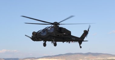 The upgraded version of the T129 Atak helicopter flies over the capital, Ankara, Türkiye, May 17, 2021. (IHA Photo)