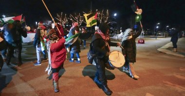 Protesters carry Palestinian flags as they participate in a torch procession before the UEFA Europa League match between Bodo/Glimt and Maccabi Tel Aviv in Bodo, Norway, Jan. 23, 2025. (EPA Photo)