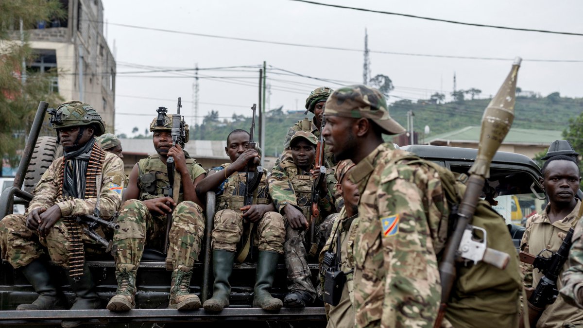 Members of the M23 rebel group gather to supervise Congolese potential recruits for the M23 rebel group before being taken to training centers run by M23 rebels, amid clashes between M23 rebels and the Armed Forces of the Democratic Republic of the Congo (FARDC), in Goma, North Kivu province in eastern Democratic Republic of the Congo, Jan. 30, 2025. (Reuters Photo)