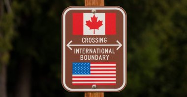 A sign marks the border between the United States and Canada at Peace Arch Park, Blaine, Washington, U.S., Feb. 1, 2025. (AFP Photo)