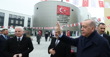 President Recep Tayyip Erdoğan greets people as he arrives for the opening of the high school complex in Istanbul, Türkiye, Feb. 3, 2025. (İHA Photo)