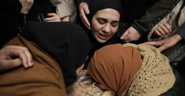 Relatives of Palestinian Mohammed Hadoush mourn over his body during his funeral in the occupied West Bank, Palestine, Feb. 3, 2025. (AFP Photo)