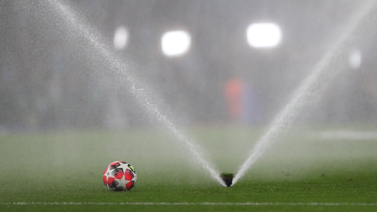 A sprinkler waters the pitch before the match between Manchester City and Club Brugge, Manchester, U.K., Jan. 29, 2025. (Reuters Photo)