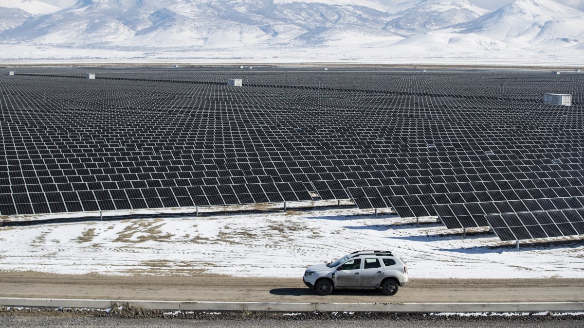 Technicians drive a car past photovoltaic panels at the Kalyon PV Karapınar Solar Power Plant, the largest in Europe, Konya, central Türkiye, Feb. 2, 2023. (EPA Photo)