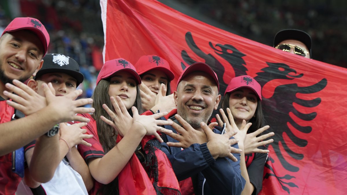  Albanian supporters gesture as they wait for the start of the Group B match between Italy and Albania at the Euro 2024 soccer tournament in Dortmund, Germany, Saturday, June 15, 2024. (AP File Photo)