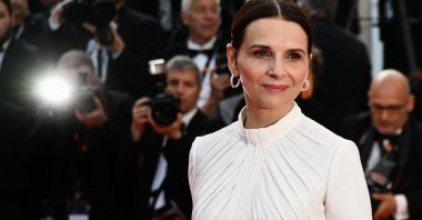 French actress Juliette Binoche arrives for the screening of the film &quot;La Passion de Dodin Bouffant&quot; (The Pot au Feu) during the 76th edition of the Cannes Film Festival in Cannes, southern France, May 24, 2023. (AFP Photo)
