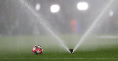 A sprinkler waters the pitch before the match between Manchester City and Club Brugge, Manchester, U.K., Jan. 29, 2025. (Reuters Photo)