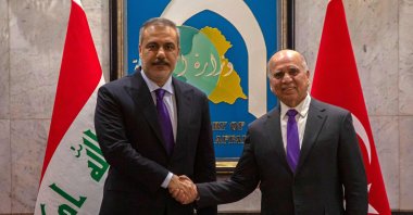 Iraqi Foreign Minister Fuad Hussein (R) welcomes Foreign Minister Hakan Fidan, Baghdad, Iraq, Jan. 26, 2025. (AFP Photo)