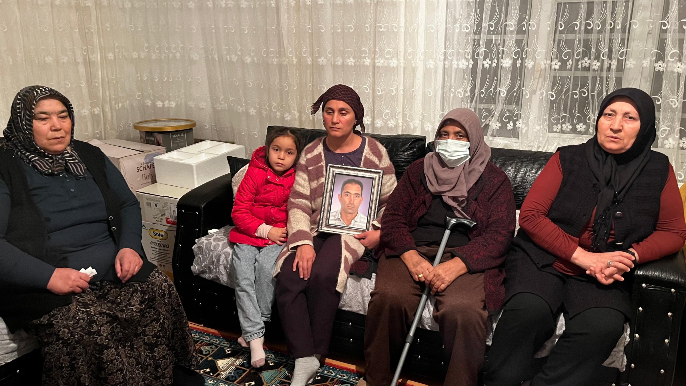 Family of Sezer Özdemir holds a picture of the missing Turk, in Kırşehir, central Türkiye, Jan. 15, 2025. (DHA Photo)