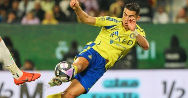Al Nassr's Cristiano Ronaldo shoots the ball during a Saudi Pro League match against Al-Fateh, in Riyadh, Saudi Arabia, Jan. 26, 2025. (AFP Photo)