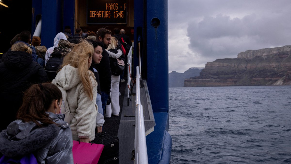 People board a ferry to Piraeus, during an increased seismic activity on the island of Santorini, Greece, Feb. 4, 2025. (Reuters Photo)