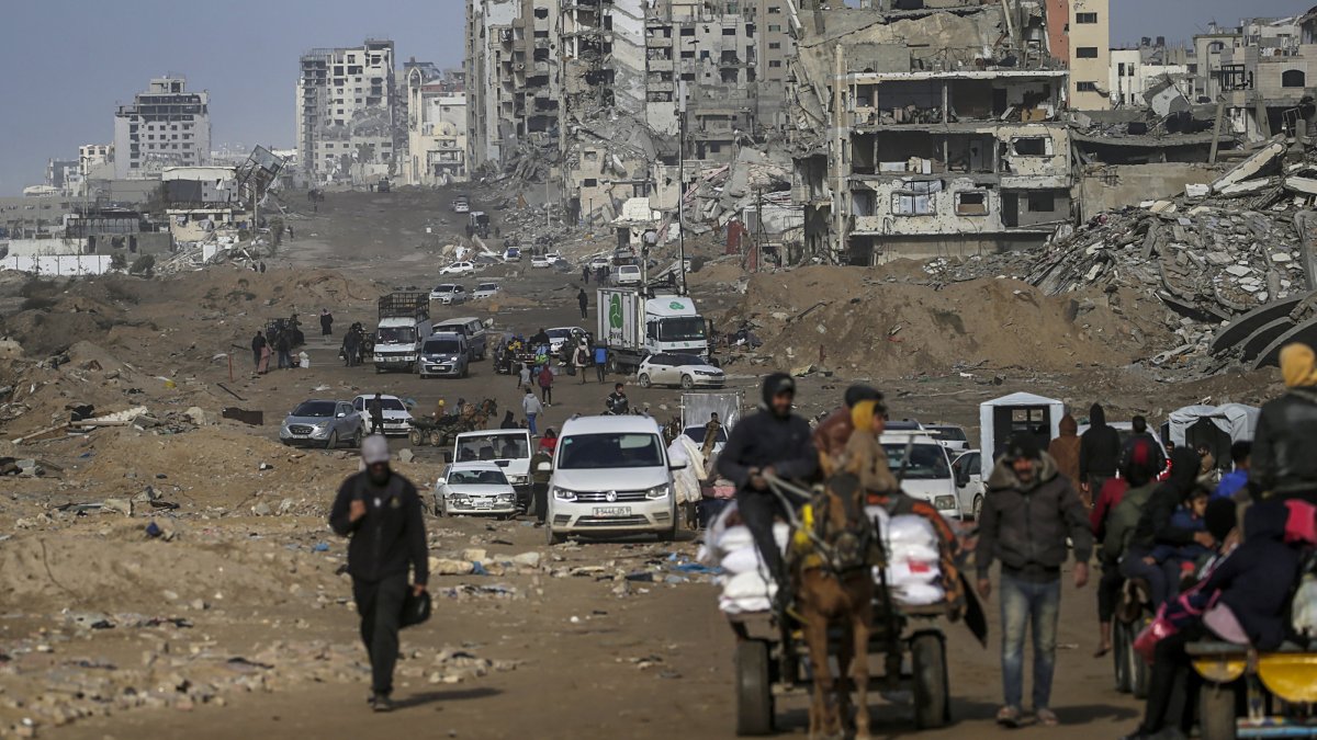 Palestinians drive past destroyed buildings in the streets of Gaza City amid a cease-fire between Israel and Hamas, Gaza Strip, Feb. 6, 2025. (EPA Photo)