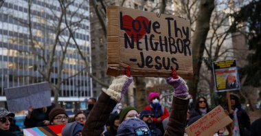 Demonstrators hold signs as they gather in protest against U.S. President Donald Trump outside New York&#039;s City Hall, New York City, U.S., Feb. 5, 2025. (Reuters Photo)
