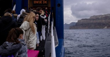 People board a ferry to Piraeus, during an increased seismic activity on the island of Santorini, Greece, Feb. 4, 2025. (Reuters Photo)