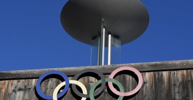The Olympic rings adorn the Stadio Olimpico del Ghiaccio, which will be called Cortina Curling Olympic Stadium, the venue for the curling discipline at the Milan Cortina 2026 Winter Olympics, Cortina d&#039;Ampezzo, Italy, Jan. 16, 2025. (AP Photo)