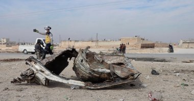 In this screen grab taken from a video, a member of the White Helmets works in the aftermath of a car bomb explosion, Manbij, Syria, Feb. 3, 2025. (Reuters Photo)
