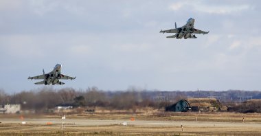 Two Russian Su-30 fighter jets take off from an airfield in Krasnodar Region, Russia, Jan. 19, 2022. (AP Photo)