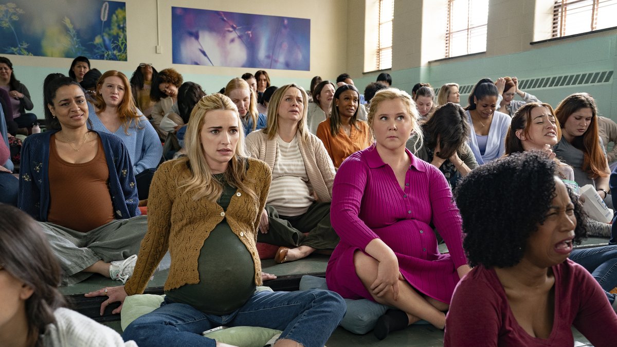 This image released by Netflix shows Brianne Howey (L) and Amy Schumer in a scene from &quot;Kinda Pregnant.&quot; (AP Photo)