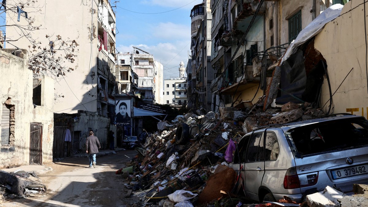 A man walks past a damaged site in the Chiyah district, after the cease-fire between Israel and Hezbollah, Beirut, Lebanon, Dec. 5, 2024. (Reuters Photo)