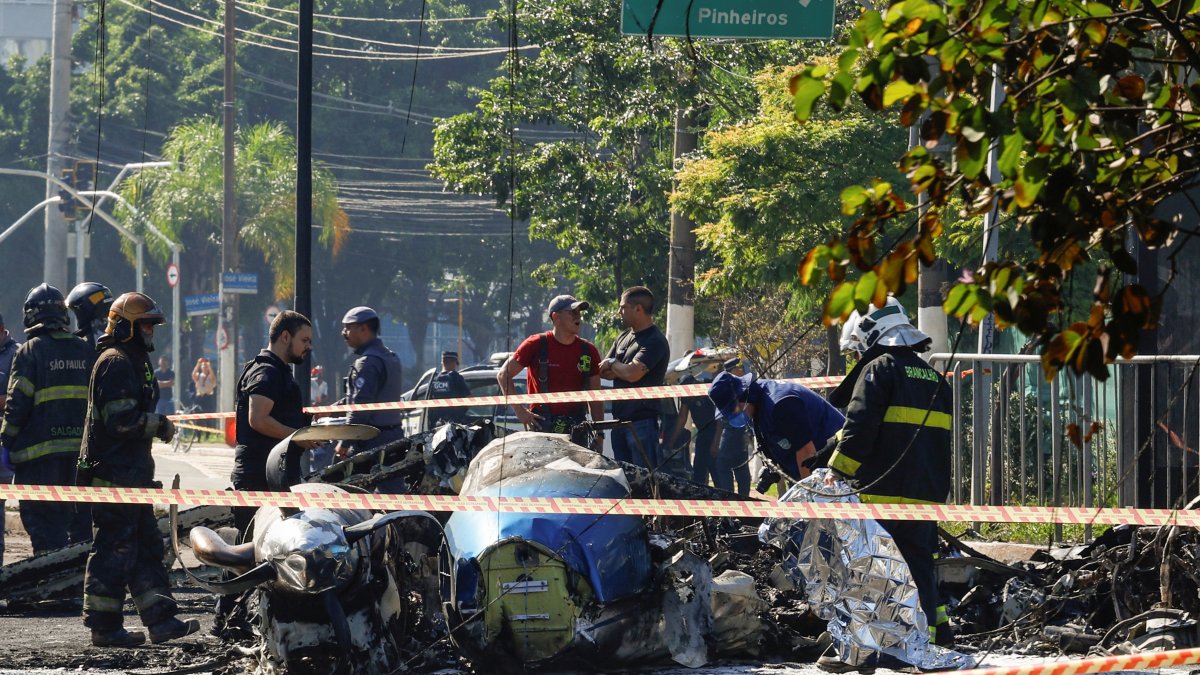 Emergency personnel work at the site where a small plane crashed into vehicles on Marques de Sao Vicente Avenue in Sao Paulo, Brazil, Feb. 7, 2025. (Reuters Photo=