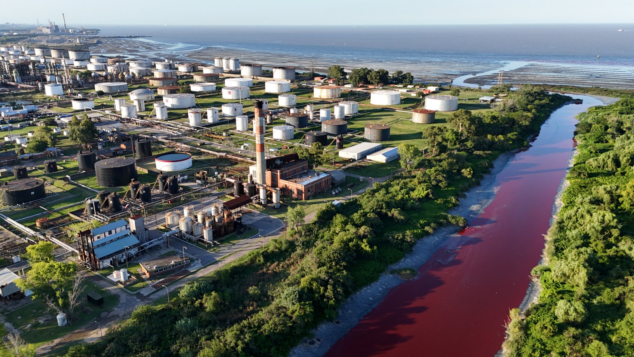 A drone view shows the Sarandi stream, which flows into the Rio de la Plata River, dyed red for unknown reasons, in Buenos Aires, Argentina Feb. 6, 2025. (Reuters Photo)