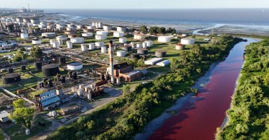 A drone view shows the Sarandi stream, which flows into the Rio de la Plata River, dyed red for unknown reasons, in Buenos Aires, Argentina Feb. 6, 2025. (Reuters Photo)
