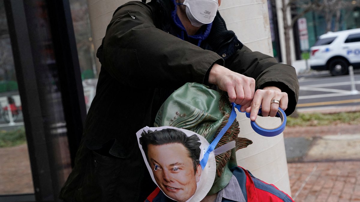 A demonstrator in a swamp monster costume has an Elon Musk mask attached to them at a protest by the Consumer Financial Protection Bureau (CFPB) building, Washington, U.S., Feb. 8, 2025. (Reuters Photo)