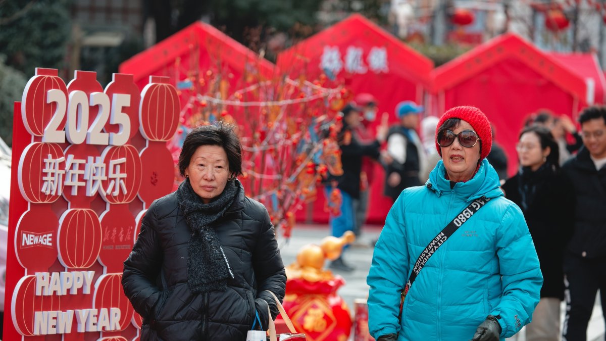 People walk through the Chinese New Year Market in Shanghai, China, Feb. 3, 2025. (EPA Photo)