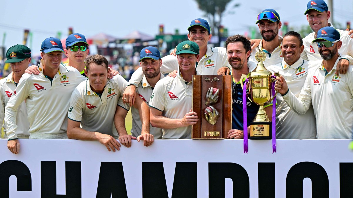 Australia&#039;s players pose with the trophies after their win in the second Test and series against Sri Lanka, Galle, Sri Lanka, Feb. 9, 2025. (AFP Photo)