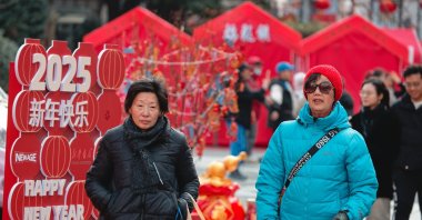People walk through the Chinese New Year Market in Shanghai, China, Feb. 3, 2025. (EPA Photo)