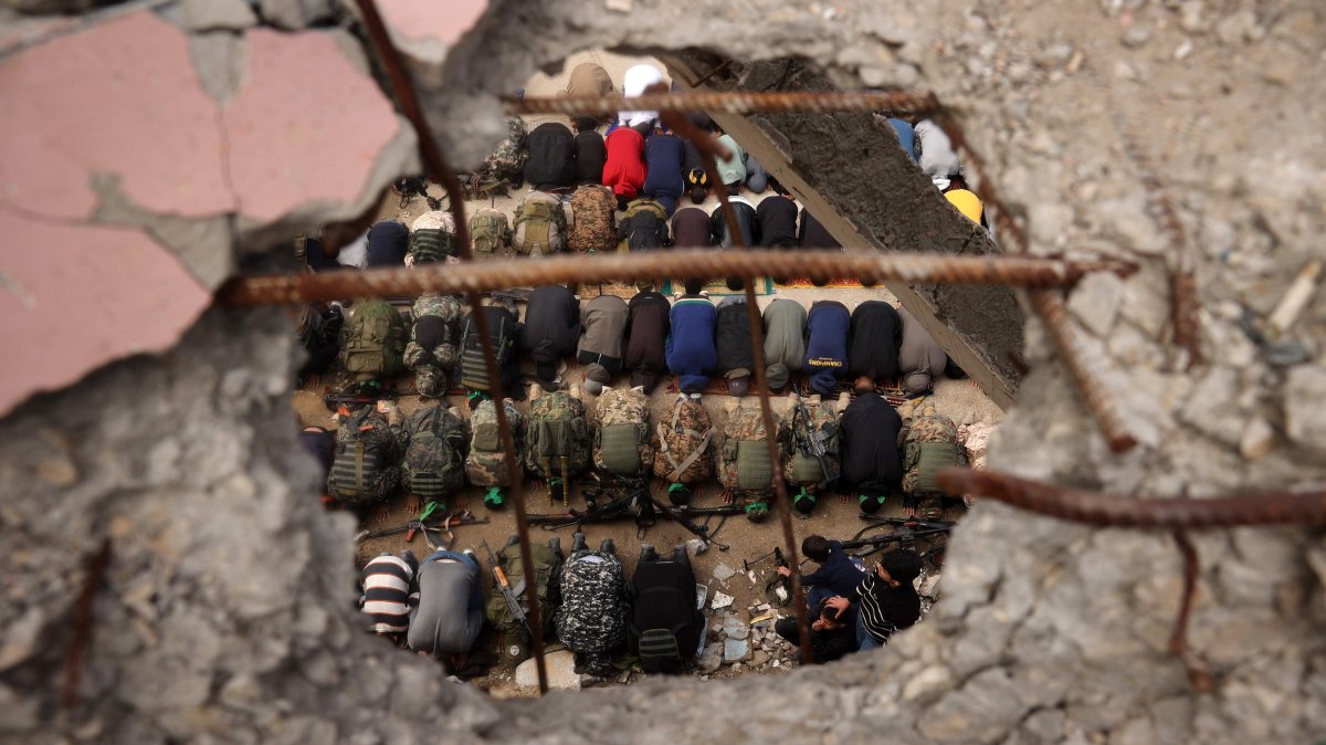 Hamas members perform the Friday noon prayer during the funeral ceremony of Marwan Issa, a top commander of the resistance group killed in March 2024, inside a sports stadium in the war-devastated Bureij refugee camp, central Gaza Strip, Palestine, Feb. 7, 2025. (AFP Photo)